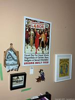 Wall showing all four framed pieces and plaque