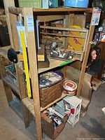 Full view of wooden shelving unit showing four shelves and overall construction