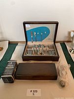 Overview of flatware chest, Oneida carving set box and anti-tarnish packet