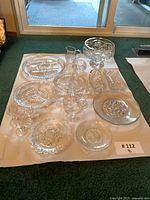 All 18 pieces laid out on white backing