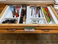 Drawer overview showing full assortment of utensils