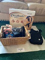 Group shot showing purse, Waterpik box, wicker basket with tools