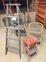Group shot showing ladder, yellow chair-step stool, red step stool