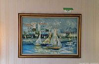 Full view of framed signed painting on wall