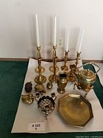 Group view of all brass items on white background