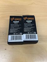 Two sealed Sondery SDN-9 boxes back view showing barcodes and specs