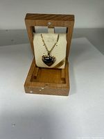 Necklace displayed in wooden box