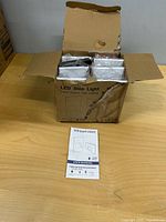 Outer shipping carton open showing individually bagged LED step lights