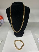 Necklace displayed on bust with bracelet below