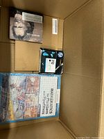 HP ink cartridge, sealed DVD, craft book inside box