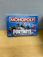 Front angled view of sealed Monopoly Fortnite box