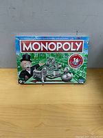 Front view of sealed Monopoly board game box