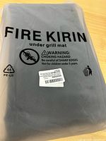 Packaged Fire Kirin under grill mat front view