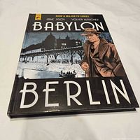 Front view of Babylon Berlin hardcover showing title, authors, artwork