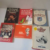 All six cartoon books laid out