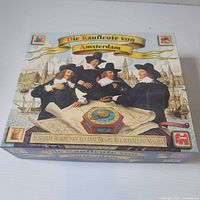 Box top showing title, artwork, publisher logos