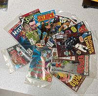 Group shot of all 11 bagged DC comics spread out