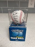 Ball in acrylic case on top of branded box