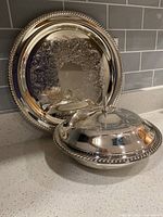 Tray and lidded serving dish side by side