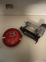 Nailer and coiled air hose together