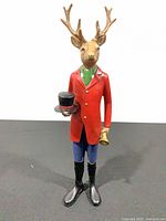 Full front view of deer figurine standing upright