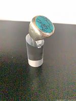 Front view of sterling silver ring with round turquoise stone