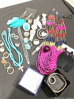 Full lot overview showing necklaces, rings, bracelets, pendants and earrings