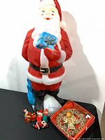Large illuminated blow-mold Santa, four small figurines, boxed illuminated angel tree topper