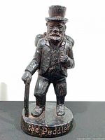 Front view showing full sculpture and base inscription