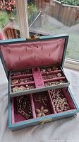 Open jewelry box showing all contents