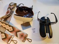 All items overview: two sunglasses with cases and woven strap