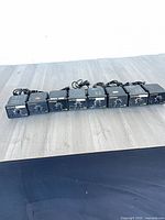 Row of eight Hakko 936 soldering station bases