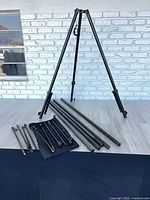 Tripod erected, mast tubes and stakes displayed