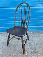 Full view of wooden Windsor chair showing design