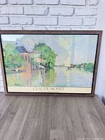 Full view of framed Monet poster print on floor