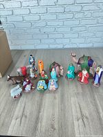 Full group of nativity figures arranged on floor