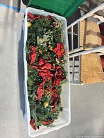 Tote filled with artificial Christmas garlands