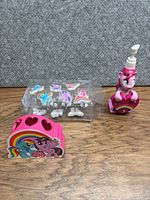 Full lot view: dispenser, toothbrush holder, packaged hooks