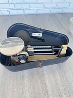 Scale in open carrying case showing overall condition