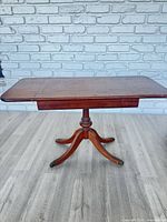 Full view of drop-leaf pedestal table