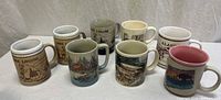 Nine mugs shown, identifying seven included souvenir mugs with rustic graphics