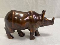 Right-side view of bronze rhinoceros figurine