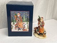 Figurine beside original box