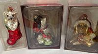 All three boxed mercury glass dog ornaments side by side