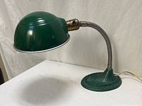 Side view of entire lamp showing shade, gooseneck, base