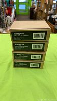 Stack of four sealed Targus adapter boxes