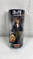 Front view of sealed Buffy action figure in cylindrical packaging