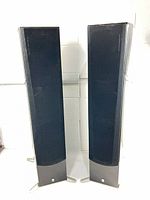 Front view of both Yamaha NS-555 floor speakers with grilles attached