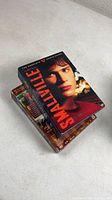 Two Smallville DVD box sets stacked