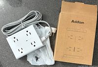 Power strip with braided cord, mounting screws, box